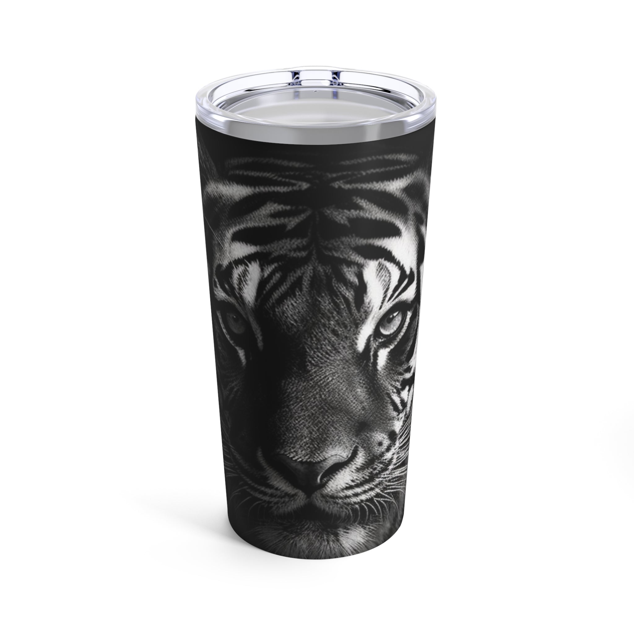 The image features a robust 20oz motivation tumbler, showcasing an awe-inspiring design of a tiger's fierce stare. The tumbler's stainless steel construction is visible, highlighted by the detailed and vibrant artwork that wraps around its surface, designed to inspire and motivate.