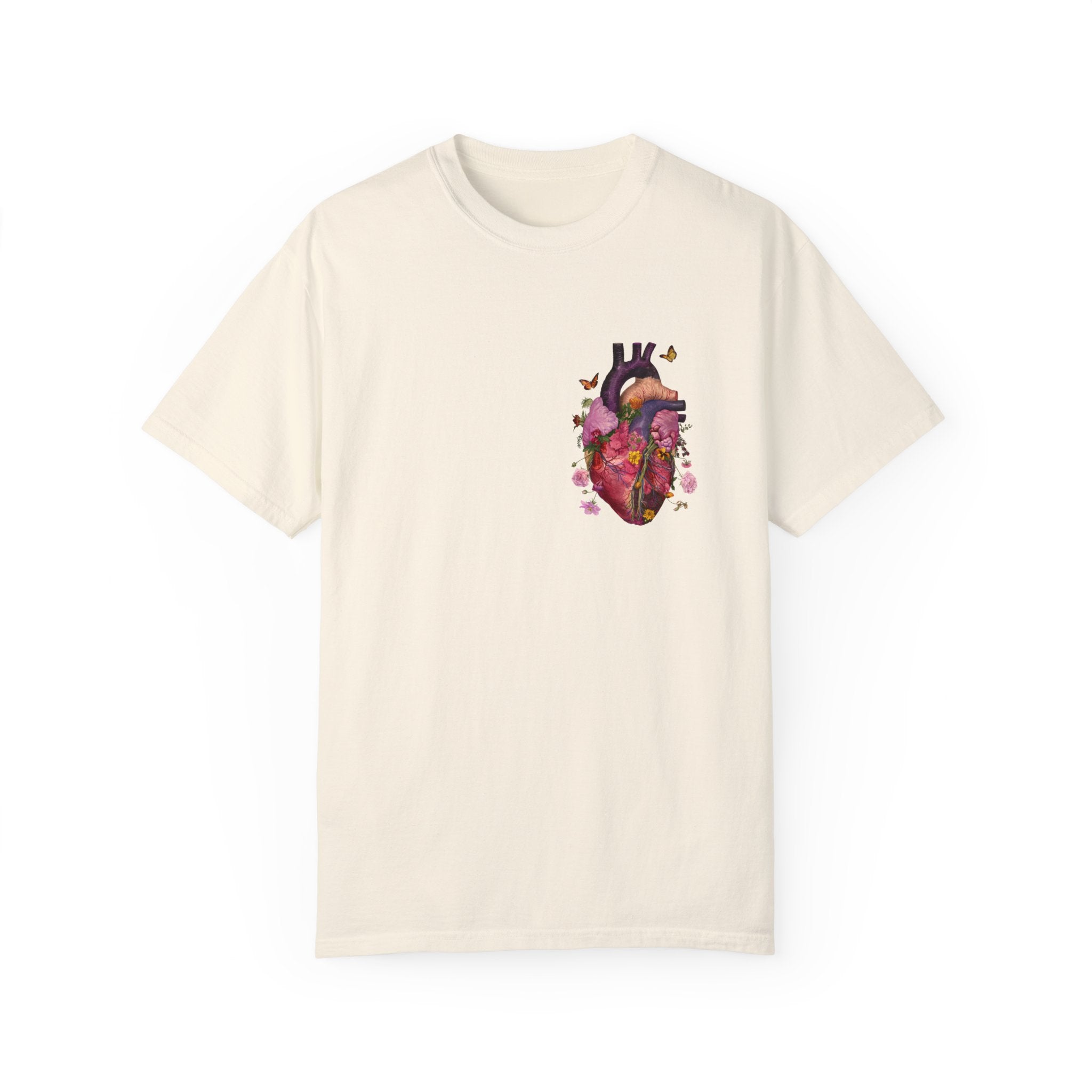 The image showcases a stylish unisex garment-dyed t-shirt, featuring a beautifully detailed illustration of a human heart intertwined with floral elements. The soft, comfortable fabric and relaxed fit are also highlighted, making it an ideal choice for any casual setting.