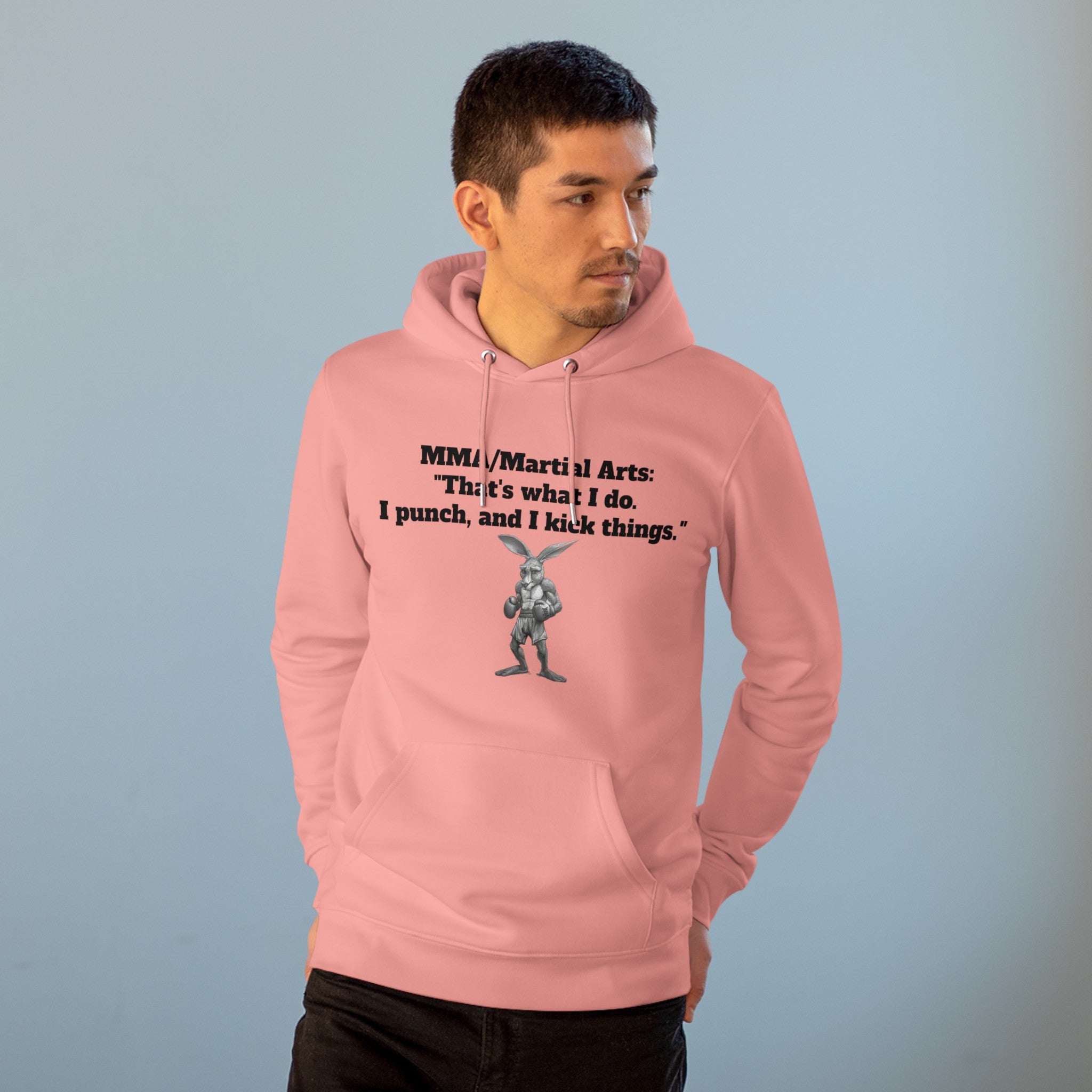 The image showcases a stylish unisex cruiser hoodie, featuring a dynamic illustration of a kangaroo in a boxing pose. The bold statement "That's What I Do. I Punch, and I Kick Things." is prominently displayed, highlighting the hoodie’s unique blend of humor and martial arts culture. The hoodie’s soft, comfortable fabric and relaxed fit are also evident.