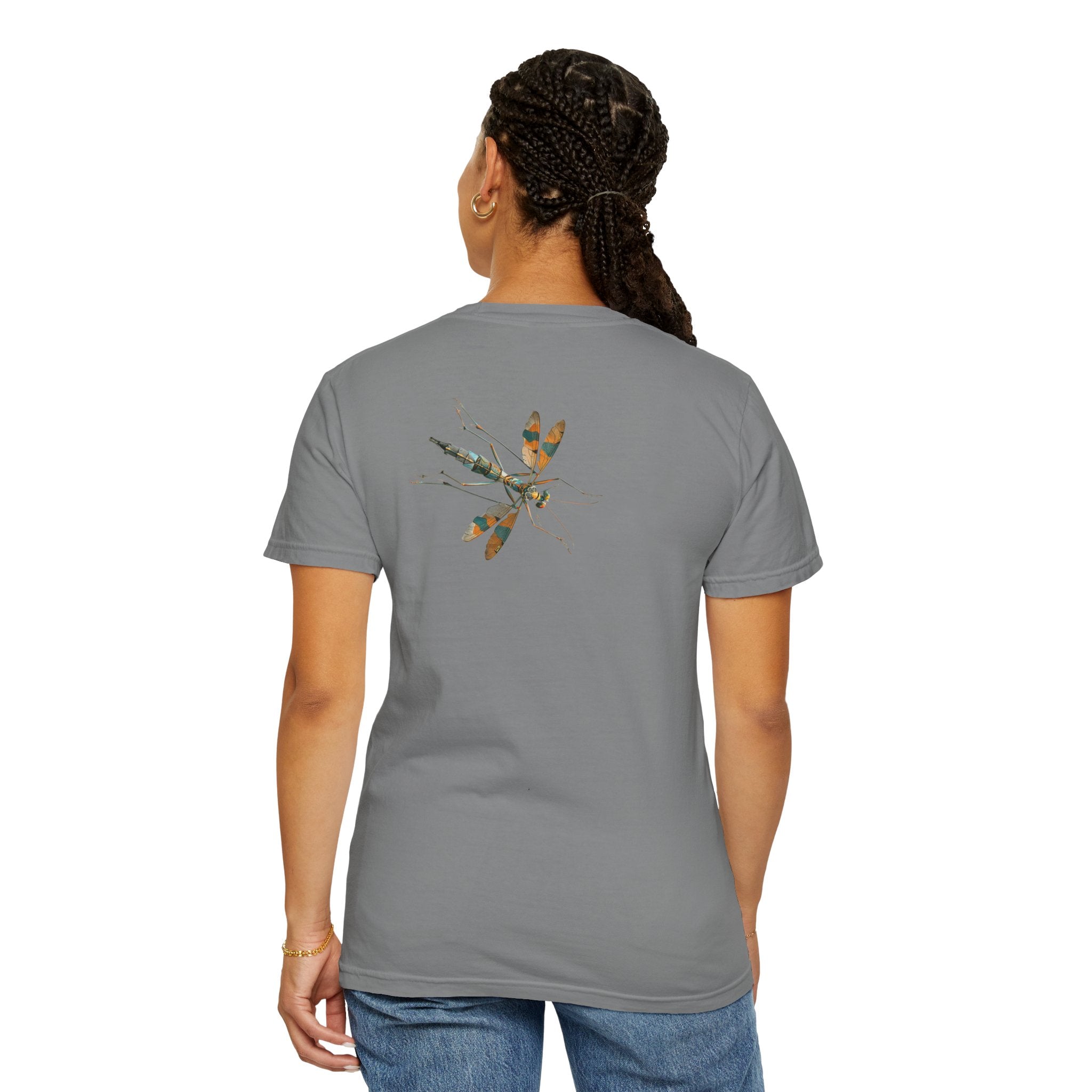 The image showcases a stylish unisex garment-dyed t-shirt in a soft, appealing color. The back of the shirt features a highly detailed, lifelike bug illustration that looks poised to crawl away. The front remains plain, directing all attention to the joke played on the unsuspecting viewers behind the wearer
