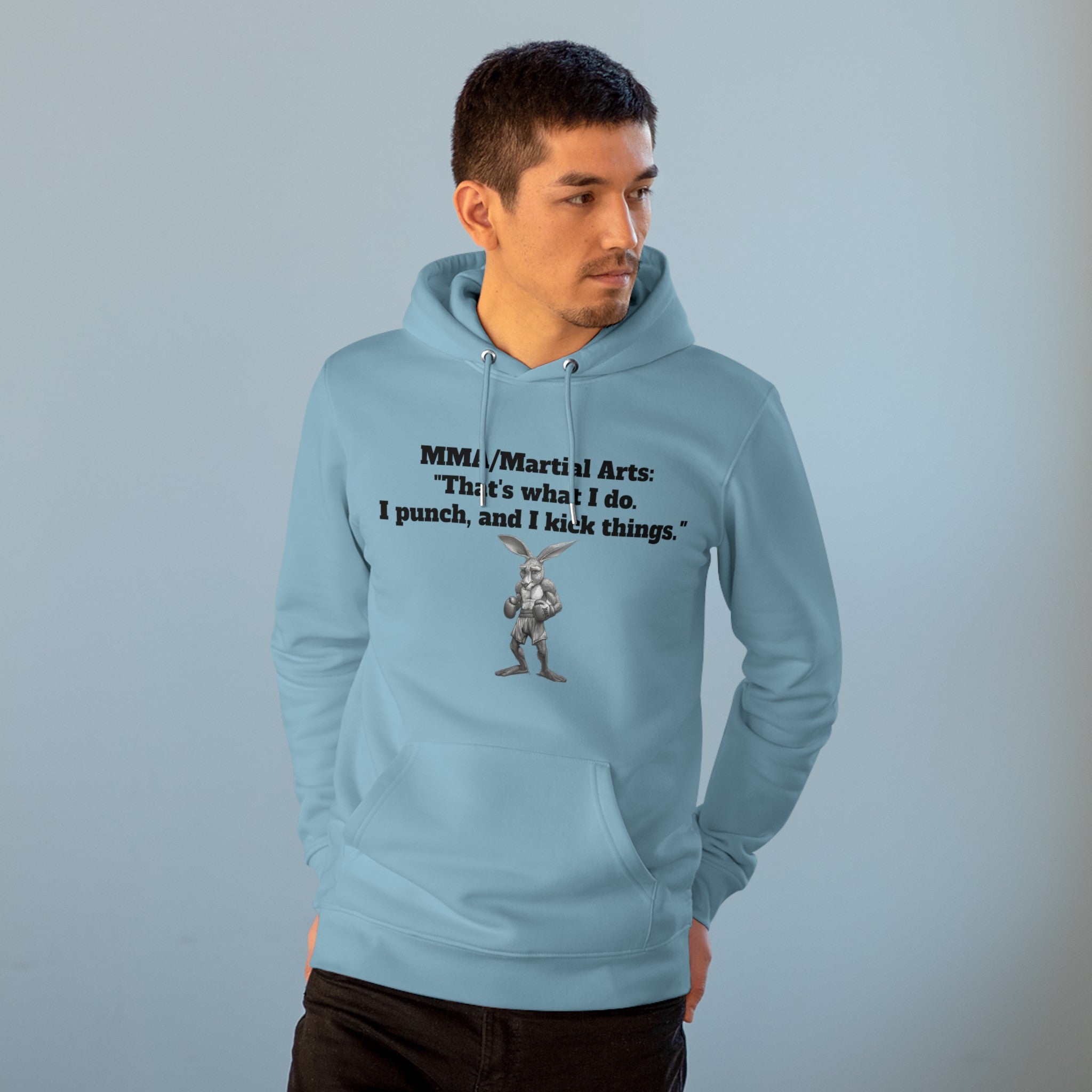 The image showcases a stylish unisex cruiser hoodie, featuring a dynamic illustration of a kangaroo in a boxing pose. The bold statement "That's What I Do. I Punch, and I Kick Things." is prominently displayed, highlighting the hoodie’s unique blend of humor and martial arts culture. The hoodie’s soft, comfortable fabric and relaxed fit are also evident.