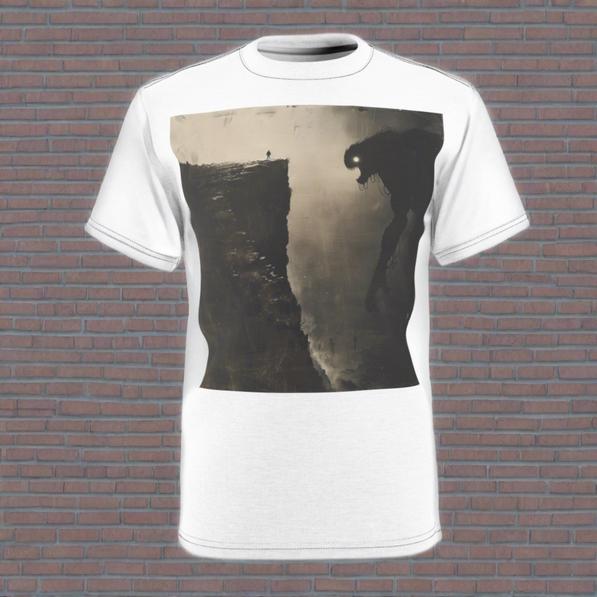 The image features a dynamic, full-coverage print on a unisex tee, showcasing an artistic rendition of a man standing resiliently on a cliff, facing the enormous shadow of a monster - a metaphor for his inner fears. The detailed artwork extends across the fabric, highlighting the tee’s cut and sew craftsmanship, while the vibrant colors and bold imagery make it a standout piece of motivational apparel.