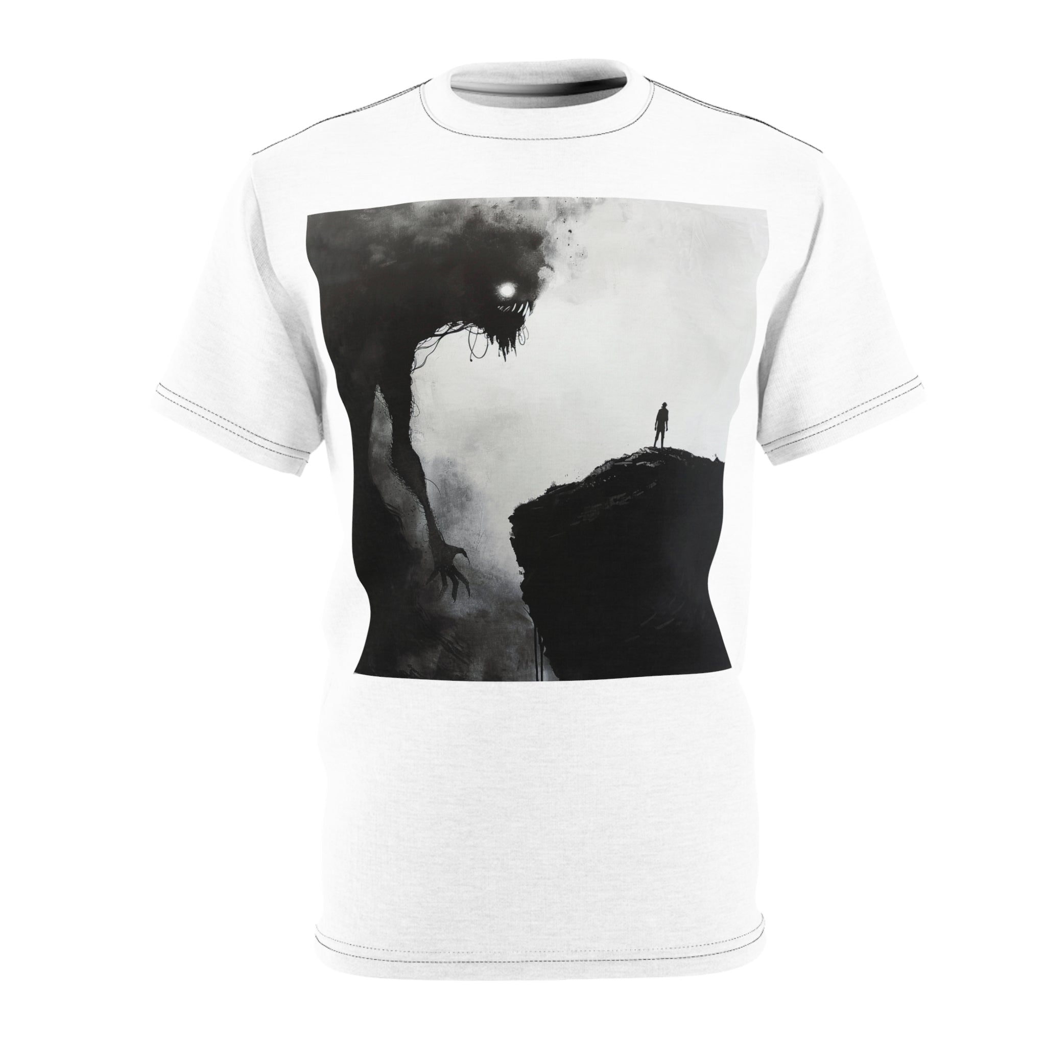 The image features a vibrant, high-quality unisex tee showcasing an evocative scene: a lone man on a cliff, facing against the immense shadow of a monster - representing his own fears and challenges. The meticulous cut and sew craftsmanship ensures that the inspiring design envelops the wearer completely, making it a piece that’s not just worn, but lived in.