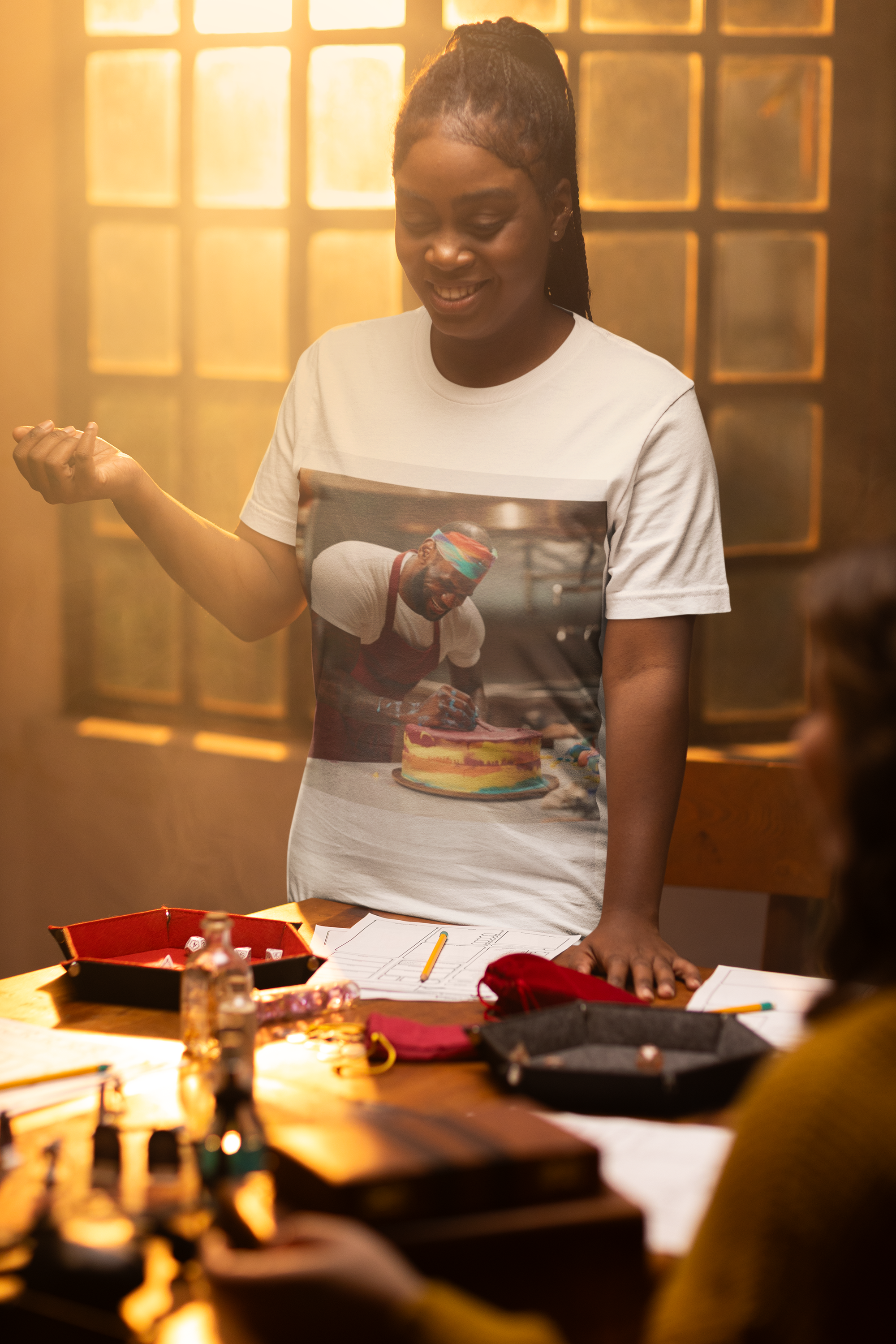 The photo features a stylish unisex garment-dyed t-shirt in a rich, inviting color. On the front, a unique design cleverly combines elements of basketball and baking, symbolizing the fusion of sports and culinary arts. The tee offers a relaxed fit, perfect for those who value comfort and style.
