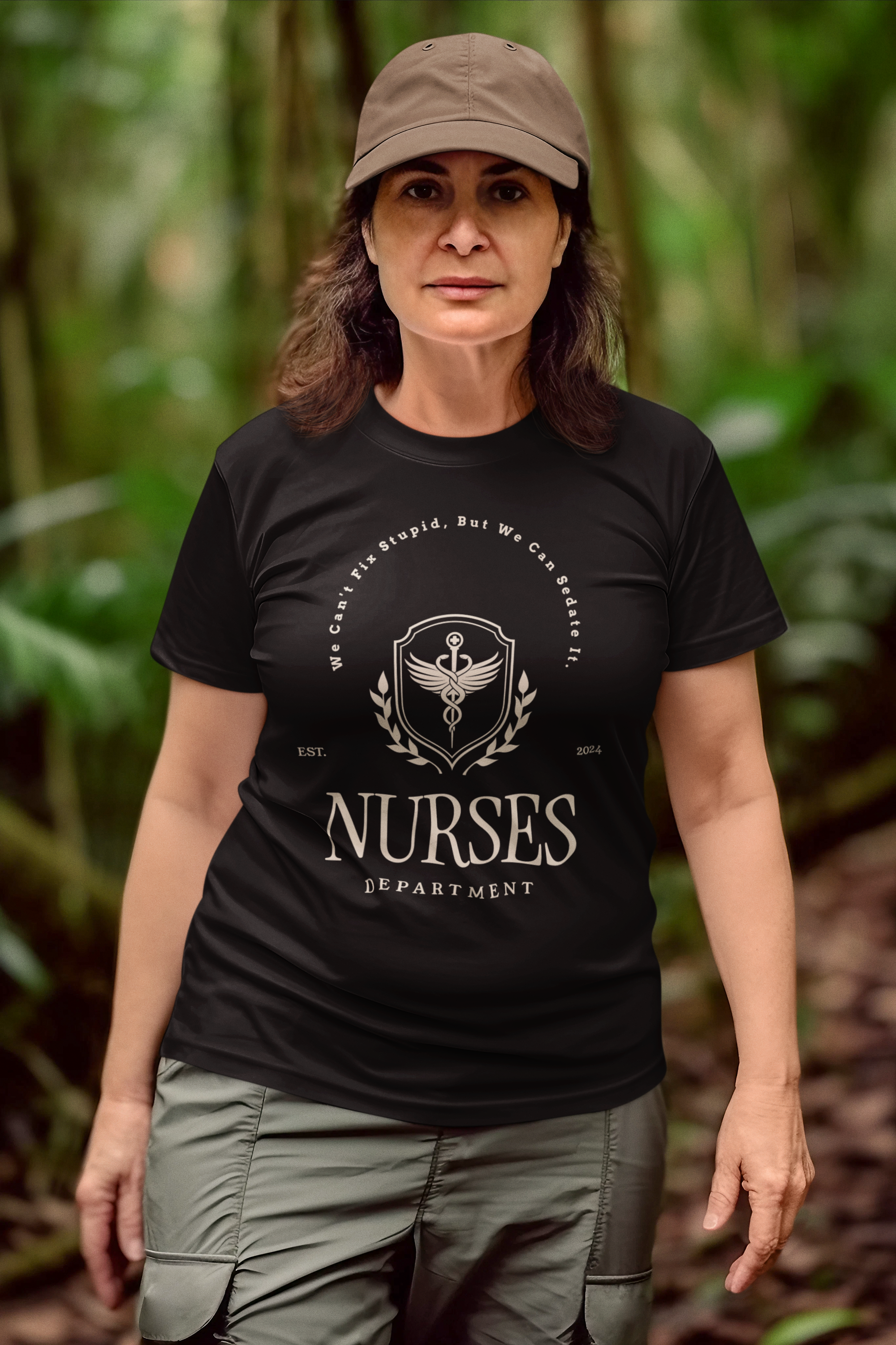 The image features a high-quality, soft, unisex jersey tee in a classic cut. The front proudly displays the humorous "We Can't Fix Stupid, But We Can Sedate It" slogan, with a customizable "Est. Date" below that adds a personal touch to the shirt. It's the perfect combination of comfort and sass that any nurse would be proud to wear on their day off or under their scrubs.